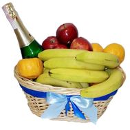 Фрукти та шампанське в кошику